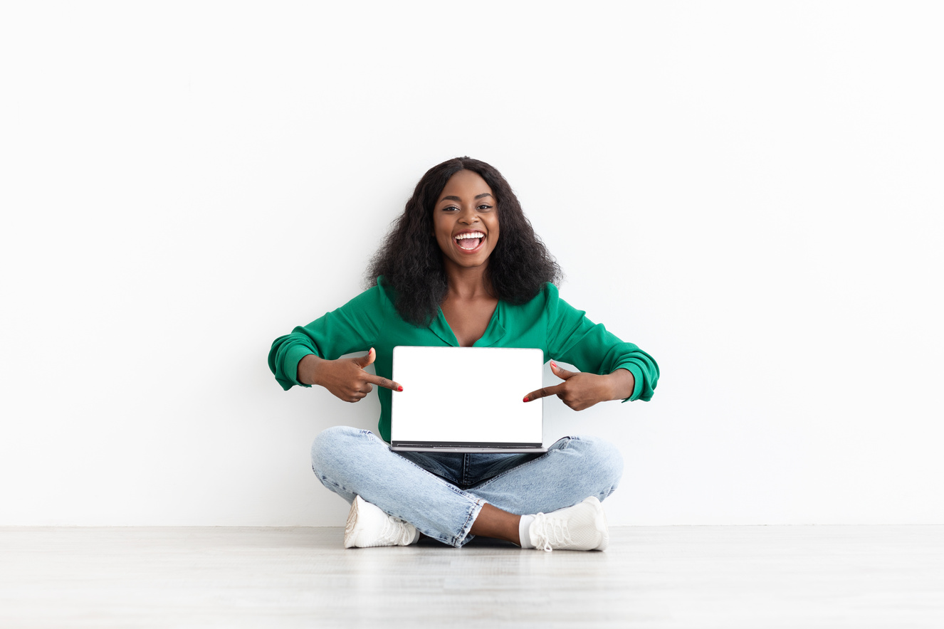 Happy Black Woman Showing Computer with Empty Screen, Mockup